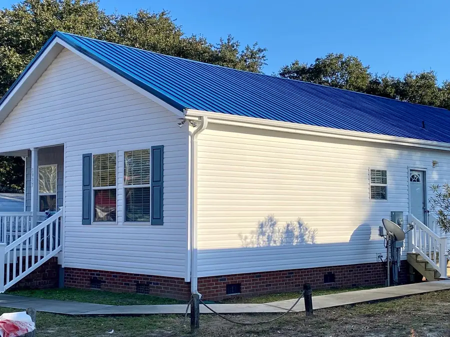 Blue metal roof on a coastal home